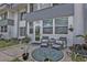 Inviting front porch with seating area, plants, and stylish decor for relaxing outdoor enjoyment at 21287 Gertrude Ave # 106, Port Charlotte, FL 33952