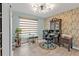 Charming home office with decorative wallpaper, stylish lighting, and comfortable workspace at 21287 Gertrude Ave # 106, Port Charlotte, FL 33952