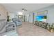 Bright living room featuring tile flooring, stylish decor, and comfortable seating at 21287 Gertrude Ave # 106, Port Charlotte, FL 33952