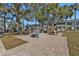 Outdoor patio with multiple BBQ grills and seating, great for entertaining at 21287 Gertrude Ave # 106, Port Charlotte, FL 33952