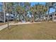 Lawn area with outdoor seating with picnic tables and barbecue grills, perfect for gatherings at 21287 Gertrude Ave # 106, Port Charlotte, FL 33952