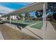 A covered shuffleboard court with benches for relaxing and watching the game at 21287 Gertrude Ave # 106, Port Charlotte, FL 33952