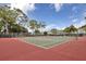 Well-maintained tennis courts with a view of the community and surrounding trees at 21287 Gertrude Ave # 106, Port Charlotte, FL 33952