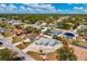 Wide aerial view of a light-colored single-story home showcasing a spacious lot and neighborhood at 21332 Walling Ct, Port Charlotte, FL 33954