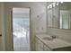 Bathroom with a sink vanity next to the entry to a living space at 21332 Walling Ct, Port Charlotte, FL 33954