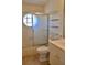 Bathroom featuring glass shower door, tile walls, open shelving, and modern sink at 21332 Walling Ct, Port Charlotte, FL 33954