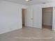 Bright bedroom featuring tile floors, neutral walls, and a mirrored closet at 21332 Walling Ct, Port Charlotte, FL 33954