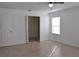 Bright bedroom with tile flooring, closet, and large window for natural light at 21332 Walling Ct, Port Charlotte, FL 33954