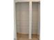Spacious closet with mirrored doors and built-in shelving for organized storage at 21332 Walling Ct, Port Charlotte, FL 33954