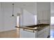 Kitchen counter with tiled floor and modern overhead lighting at 21332 Walling Ct, Port Charlotte, FL 33954