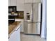 Stainless steel refrigerator with water dispenser is showcased in the bright kitchen at 21332 Walling Ct, Port Charlotte, FL 33954