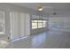Bright living room with tile flooring, multiple windows, and ceiling fans at 21332 Walling Ct, Port Charlotte, FL 33954