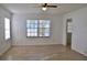 Well-lit living room with large windows and tile flooring for easy maintenance at 21332 Walling Ct, Port Charlotte, FL 33954