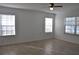 Bright living room with tile flooring, ceiling fan, and multiple windows at 21332 Walling Ct, Port Charlotte, FL 33954
