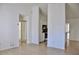 Open living room features tile floors and seamless flow into the kitchen at 21332 Walling Ct, Port Charlotte, FL 33954