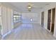 Spacious sunroom featuring tile flooring, sliding glass doors, and a bright interior at 21332 Walling Ct, Port Charlotte, FL 33954