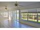 Bright sunroom with tile floors, white walls, and large windows overlooking the outdoors at 21332 Walling Ct, Port Charlotte, FL 33954