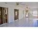 Sunroom with tile flooring, sliding glass doors, and views of kitchen and backyard at 21332 Walling Ct, Port Charlotte, FL 33954