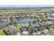 Beautiful aerial view of lakeside homes showing lush landscaping in a quiet, well-maintained neighborhood at 24528 Sunrise Dr, Punta Gorda, FL 33980