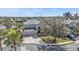 Two-story home featuring an attached three-car garage, well-maintained lot and community water feature at 24528 Sunrise Dr, Punta Gorda, FL 33980