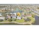 Aerial view of lakeside home, located on a well-maintained lot and located within quiet neighborhood at 24528 Sunrise Dr, Punta Gorda, FL 33980