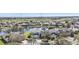 Aerial view of lakeside homes highlighting lush landscaping in a quiet, well-maintained neighborhood at 24528 Sunrise Dr, Punta Gorda, FL 33980