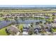 Beautiful aerial view of lakeside homes showing lush landscaping in a quiet, well-maintained neighborhood at 24528 Sunrise Dr, Punta Gorda, FL 33980