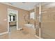 Stylish bathroom boasting a soaking tub, separate shower, and neutral tile flooring at 24528 Sunrise Dr, Punta Gorda, FL 33980