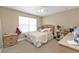 Comfortable bedroom with a plush bed, neutral walls, and natural light creating a peaceful atmosphere at 24528 Sunrise Dr, Punta Gorda, FL 33980