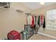 Walk-in closet with ample hanging space, wire shelving, and room for storage at 24528 Sunrise Dr, Punta Gorda, FL 33980