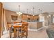 Bright dining room with a wooden table and chairs, complemented by pendant lighting at 24528 Sunrise Dr, Punta Gorda, FL 33980