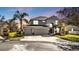 Well-maintained two story home featuring a three car garage, landscaped yard, and beautiful curb appeal at 24528 Sunrise Dr, Punta Gorda, FL 33980