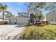 Beautiful home with a three-car garage, well-kept landscaping, and a spacious driveway at 24528 Sunrise Dr, Punta Gorda, FL 33980