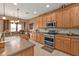 Spacious kitchen equipped with stainless steel appliances, ample cabinetry and countertop workspace at 24528 Sunrise Dr, Punta Gorda, FL 33980