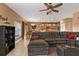 Comfortable living room featuring a large sectional sofa and view into the kitchen at 24528 Sunrise Dr, Punta Gorda, FL 33980
