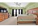 Comfortable main bedroom with a large wooden dresser and a ceiling fan at 24528 Sunrise Dr, Punta Gorda, FL 33980