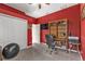 Office featuring a white closet, sleek TV, bookshelf, and desk with comfortable chair at 24528 Sunrise Dr, Punta Gorda, FL 33980