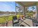 Relaxing screened patio with comfortable seating and views of the lake at 24528 Sunrise Dr, Punta Gorda, FL 33980