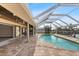 A private pool with a screened enclosure and an outdoor kitchen, providing an ideal space for relaxation and entertainment at 3115 Guadalupe Dr, Punta Gorda, FL 33950