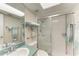 This bathroom features a shower with glass door and a large mirror at 3233 Wood Thrush Dr # 23C, Punta Gorda, FL 33950