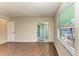 Well-lit bedroom with wood-look floors, patio access and waterfront views at 3233 Wood Thrush Dr # 23C, Punta Gorda, FL 33950