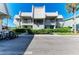 Condominium exterior with well-maintained landscaping and ample parking at 3233 Wood Thrush Dr # 23C, Punta Gorda, FL 33950