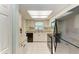 Efficient kitchen with white cabinetry, stainless steel sink, and black appliances at 3233 Wood Thrush Dr # 23C, Punta Gorda, FL 33950