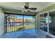 Screened lanai with tile floors, ceiling fan, and waterfront views at 3233 Wood Thrush Dr # 23C, Punta Gorda, FL 33950