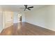 Inviting living room boasting wood-look floors and views into the home's kitchen at 3233 Wood Thrush Dr # 23C, Punta Gorda, FL 33950