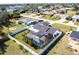 This property features a fenced-in backyard with a screened-in pool at 3348 Pinetree St, Port Charlotte, FL 33952