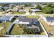 Aerial view of the fenced-in property, featuring a screened-in pool at 3348 Pinetree St, Port Charlotte, FL 33952