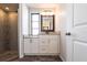 Modern bathroom featuring a walk-in shower and sleek vanity with granite countertop at 3348 Pinetree St, Port Charlotte, FL 33952