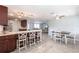 Kitchen island view with bar stool seating leading to dining area at 3348 Pinetree St, Port Charlotte, FL 33952