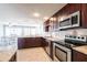 Bright kitchen features stainless steel appliances, ample counter space, and a dining area at 3348 Pinetree St, Port Charlotte, FL 33952